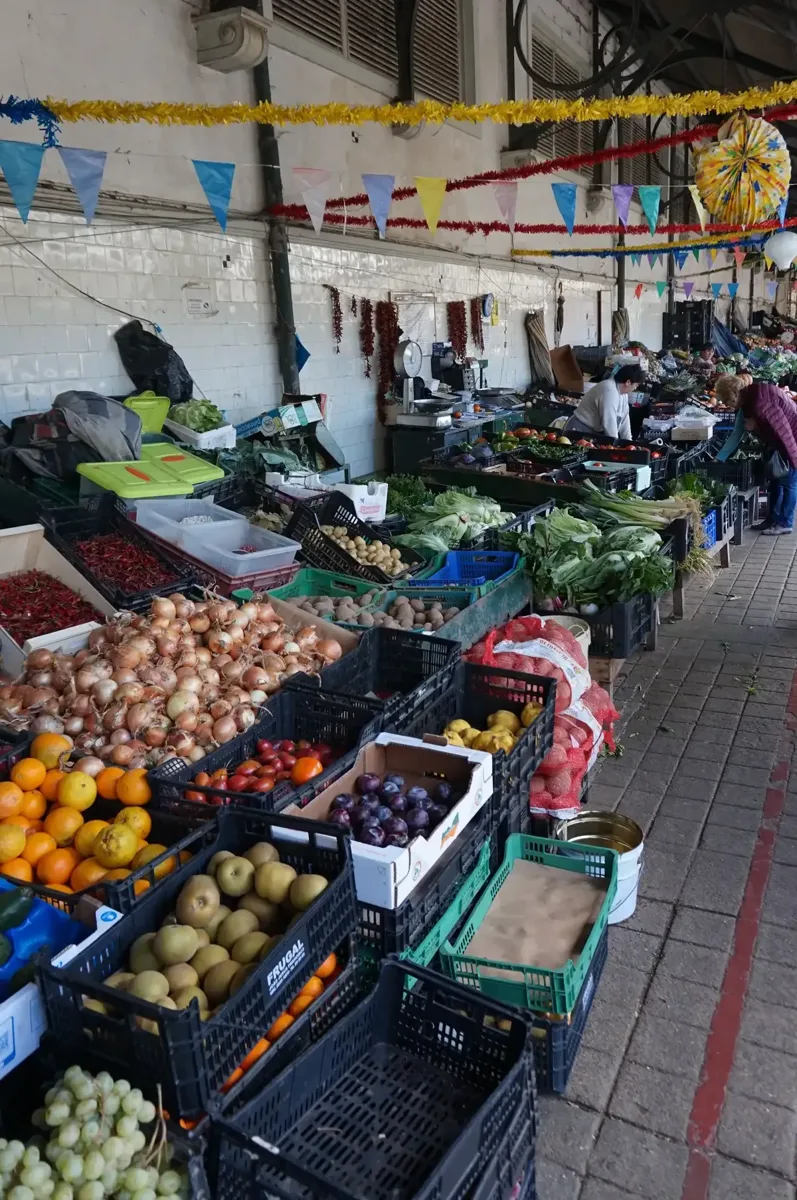 Fruit stalls at Mercado do Bolhão on a Porto food and wine walking tour