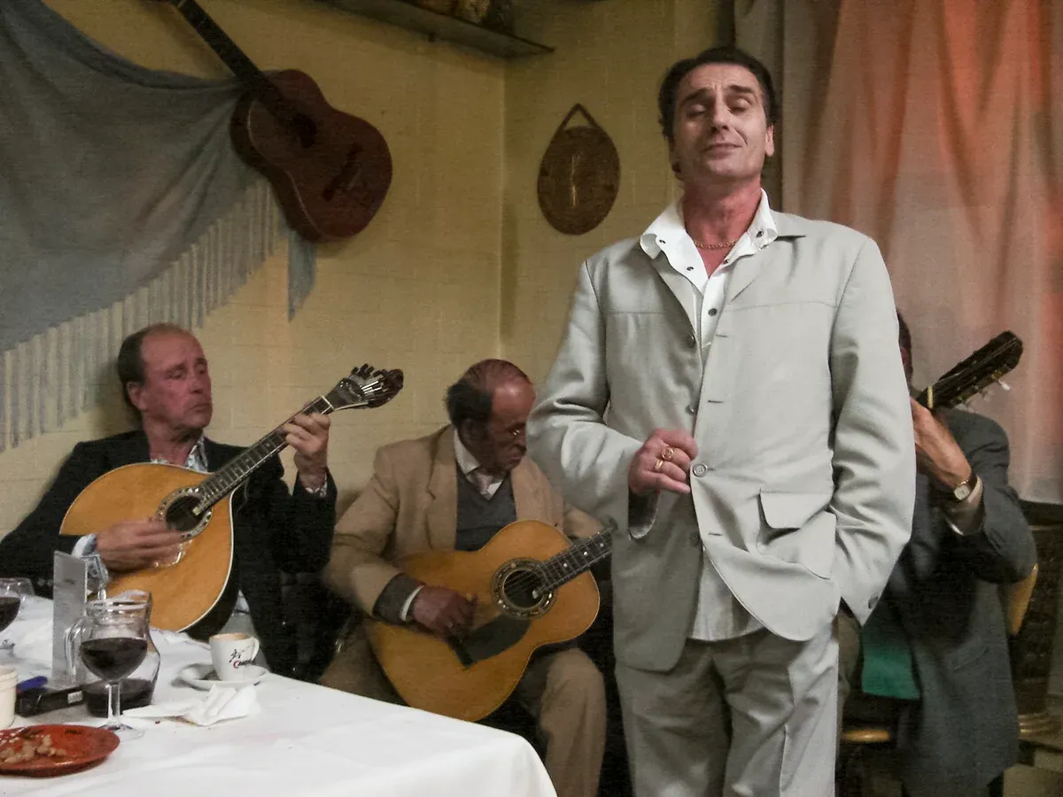 Fado singer and guitarists at a Porto venue, the music side of a Fonseca cellar tour with fado