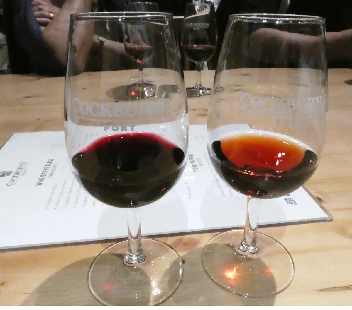 Ruby and tawny port in two glasses compared at a port wine tasting in Porto