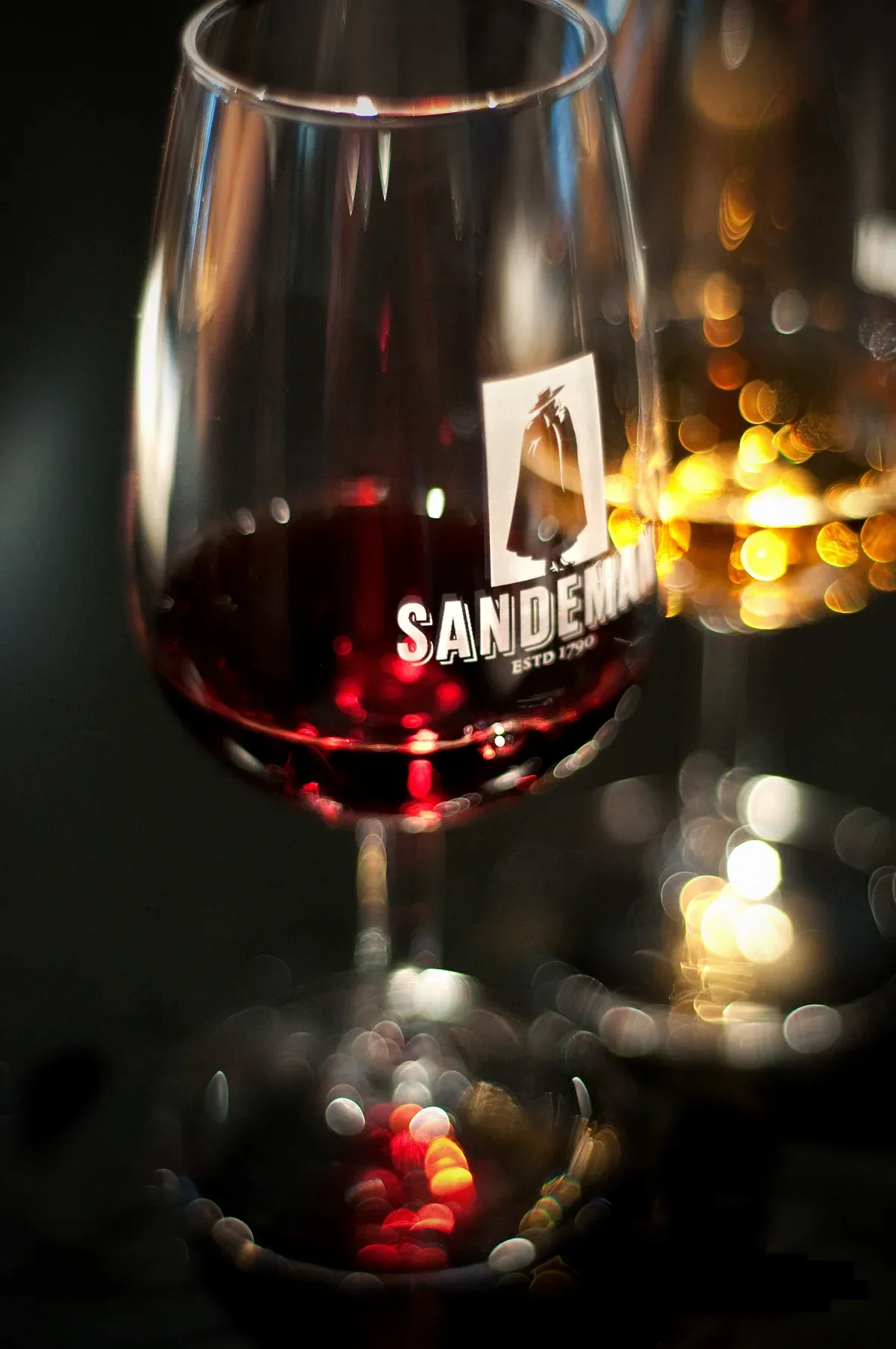 Sandeman glass of port poured at a port wine tasting in Vila Nova de Gaia, Porto