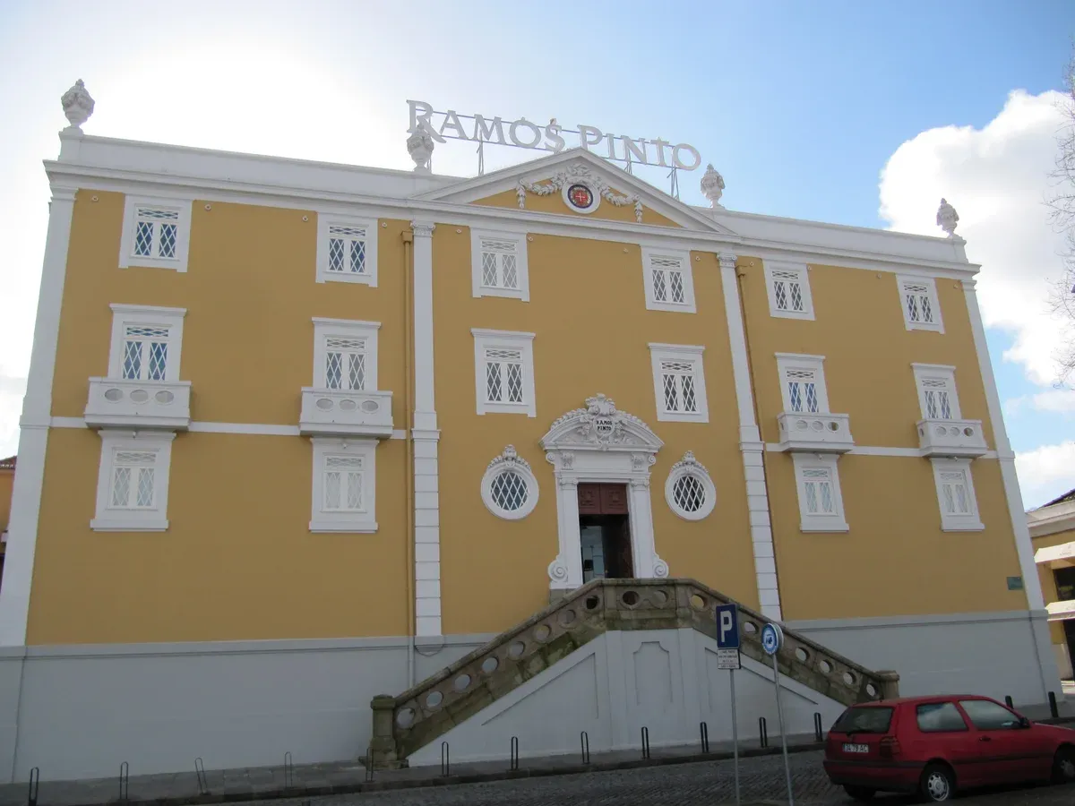 The yellow Ramos Pinto building in Vila Nova de Gaia, a port lodge visited on Porto wine tours